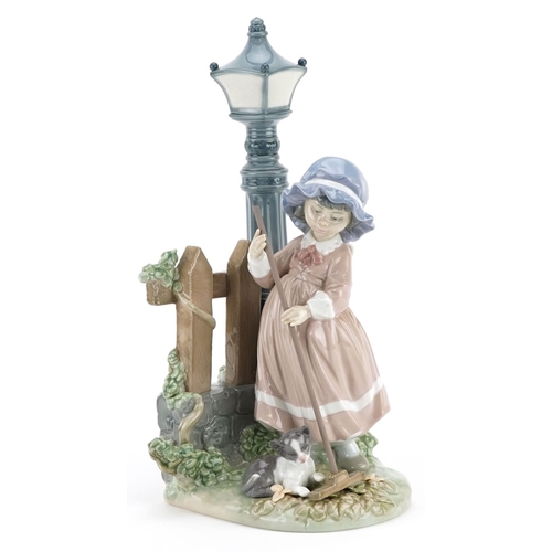 723 - A Lladro figure of a young girl sweeping leaves - Fall Clean Up, numbered 5286, 34cm high, with box.