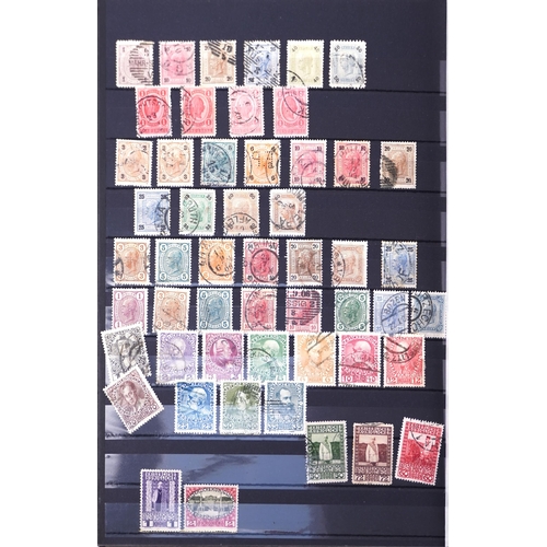 1519 - A red stamp album with 19th century and later stamps of Italy, Switzerland and Austria.