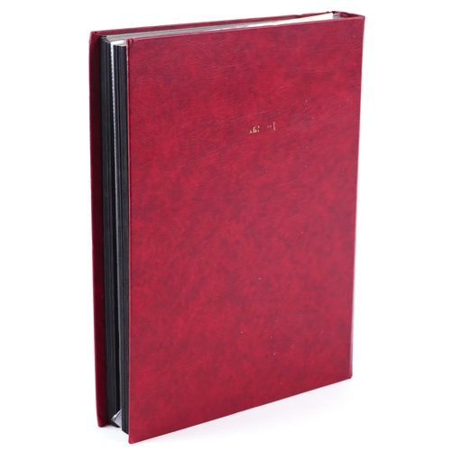 1519 - A red stamp album with 19th century and later stamps of Italy, Switzerland and Austria.