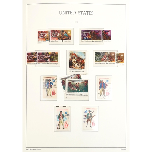 1529 - Four stamps albums containing mint American examples, mainly 20th century, including commemorative i... 