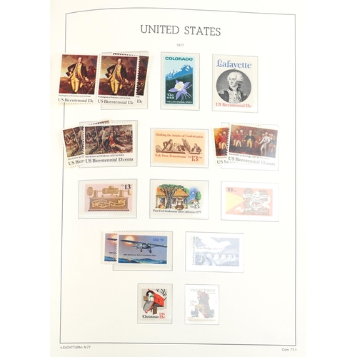 1529 - Four stamps albums containing mint American examples, mainly 20th century, including commemorative i... 