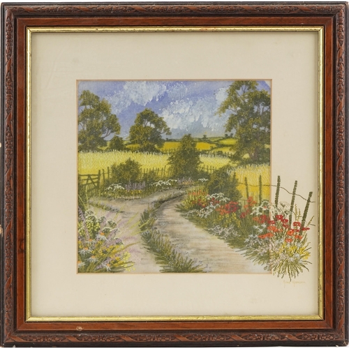 202 - A mid 20th century hand painted and embroidered landscape picture by Anne Harrison, within a carved ... 