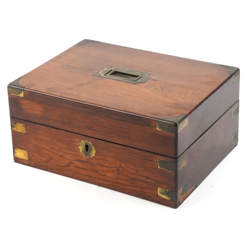 20 - A George III rosewood and brass bound jewellery box, the hinged lid revealing a fitted interior, 30c... 