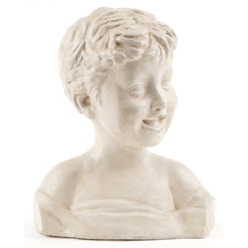 120 - A 20th century plaster head and shoulders bust of a young boy, 30cm high.