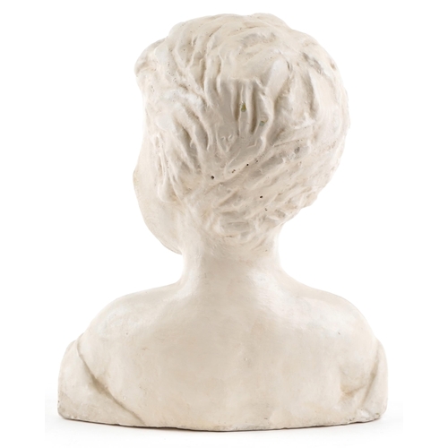 120 - A 20th century plaster head and shoulders bust of a young boy, 30cm high.