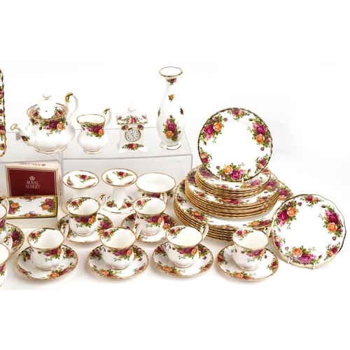 450 - A Royal Albert Old Country Roses dinner and tea service including a coffee pot and a cake stand.