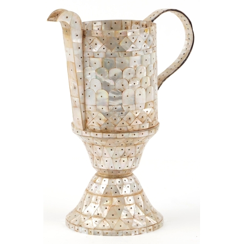 271 - An Indian Goa mother-of-pearl jug, 27cm high.