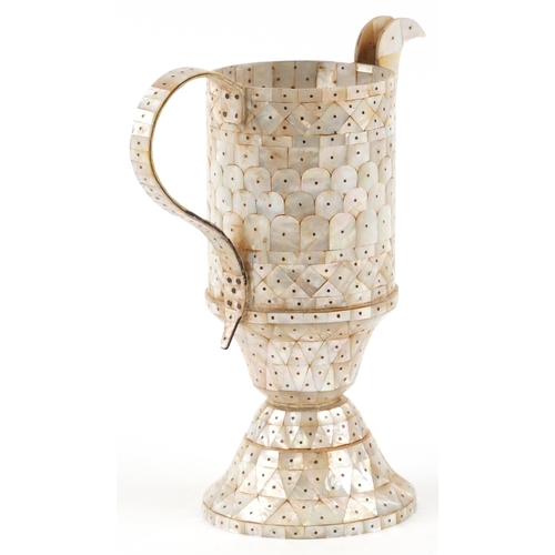 271 - An Indian Goa mother-of-pearl jug, 27cm high.