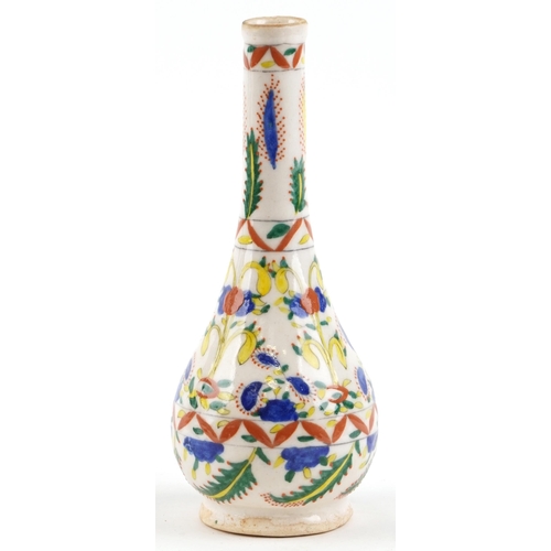 367 - A Turkish Ottoman Kütahya vase hand painted with stylized flowers, 24cm high.