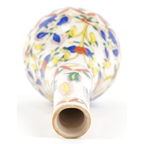 367 - A Turkish Ottoman Kütahya vase hand painted with stylized flowers, 24cm high.