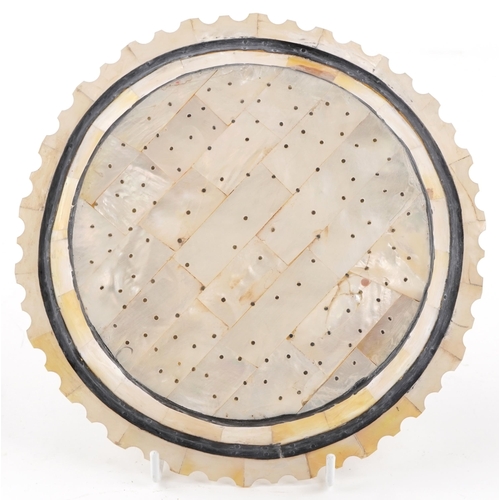 171 - An Indian Goan mother-of-pearl plate, 22cm in diameter.