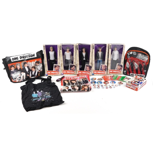 545 - A group of One Direction collectables including five figures with box, side bag, calendar and a lunc... 