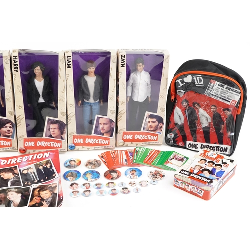 545 - A group of One Direction collectables including five figures with box, side bag, calendar and a lunc... 