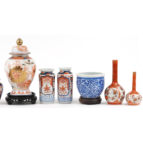 328 - A mixed group of Chinese and Japanese porcelain items including a pair of vases and covers, a gradua... 