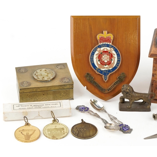 1226 - A small group of collector's items to include two Society of Miniature Rifle Club silver spoons sets... 