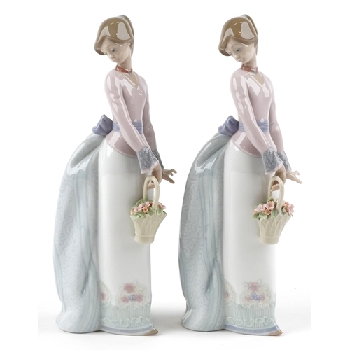 766 - Two Lladro figures of a young lady holding a flower basket - Basket of Love, each numbered 7622, eac... 