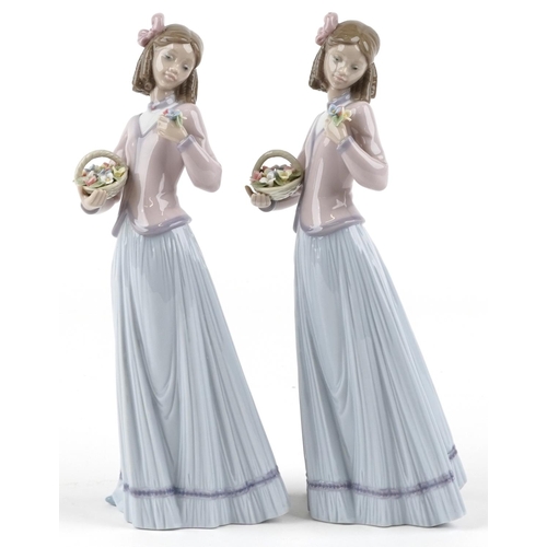 761 - Two Lladro figures of a young lady holding a flower basket - Innocence in Bloom, each numbered 7644,... 