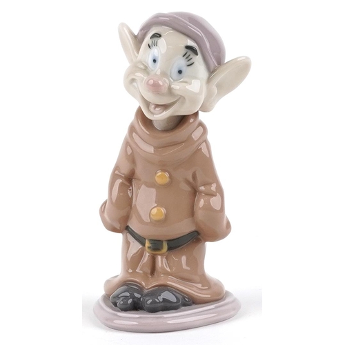 747 - A Lladro figure of a Snow White dwarf - Dopey, 14cm high, with box, the box numbered 07534.