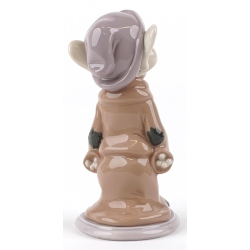 747 - A Lladro figure of a Snow White dwarf - Dopey, 14cm high, with box, the box numbered 07534.