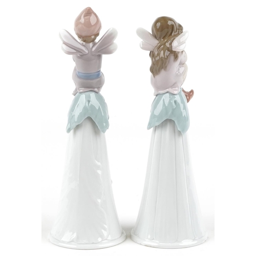 765 - Two Lladro bells in the form of fairies - It's a Girl!, It's a Boy,the largest 19.5cm high, with box... 