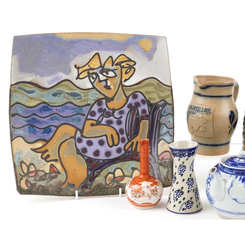 1295 - A mixed group of decorative ceramics to include a hanging wall plaque, two blue and white teapots, t... 