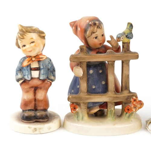 430 - A Royal Doulton pottery cat, 21cm high, together with two Goebel figures and a Capodimonte figure.