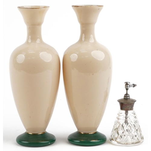 251 - A pair of early 20th century French hand painted opaline glass vases, 28cm high, together with a sil... 