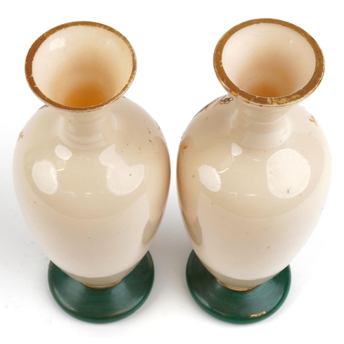 251 - A pair of early 20th century French hand painted opaline glass vases, 28cm high, together with a sil... 