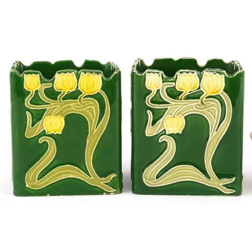 1355 - A pair of Austrian Art Nouveau pottery planters of square form decorated with flowers, 9cm high, tog... 