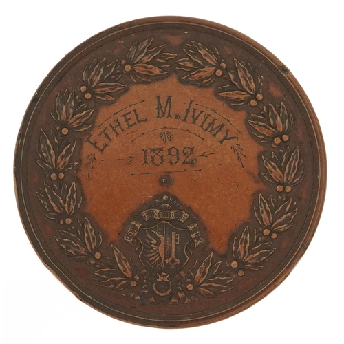 1457 - A large bronze 19th century musical medal awarded to Ethel M. Ivimy, 1892, 52.5mm in diameter.