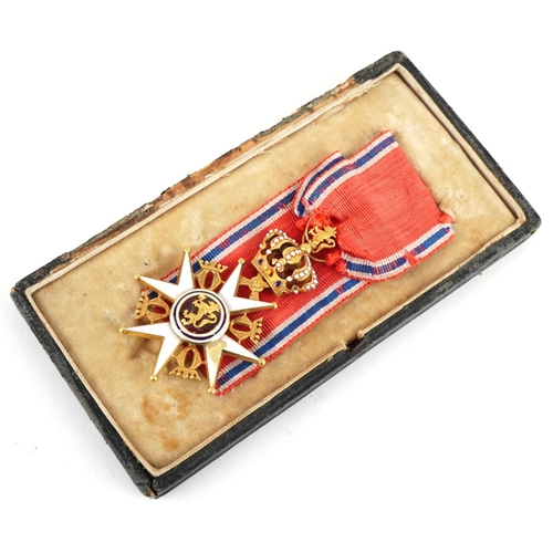 A Norwegian Military Division Order of Olav gold and enamel knights breast badge.