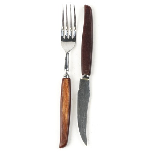 1218 - A large collection of Glosswood stainless steel Sheffield cutlery with wooden handles.