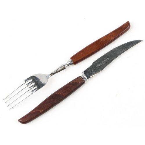 1218 - A large collection of Glosswood stainless steel Sheffield cutlery with wooden handles.