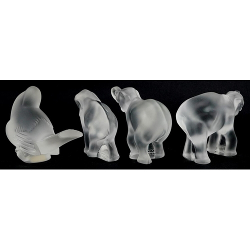 434 - A group of four late 20th century Lalique frosted glass figures comprising three elephants and a son... 