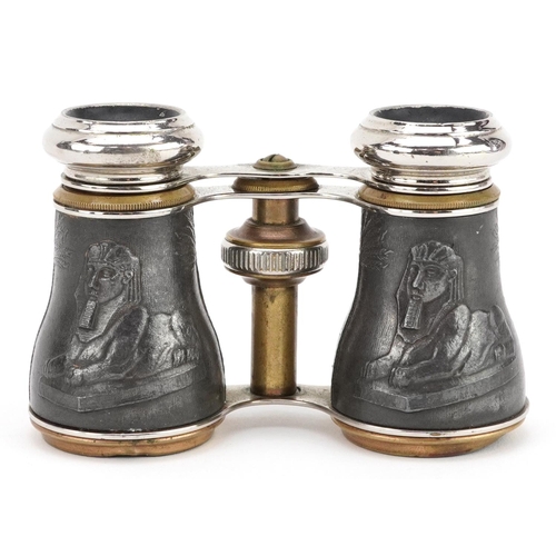 1260 - A pair of early 20th century French Egyptianesque brass and chromium plated opera glasses, 10cm wide... 