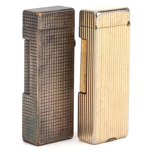 293 - Two Dunhill engine turned pocket lighters, each 6.5cm high.