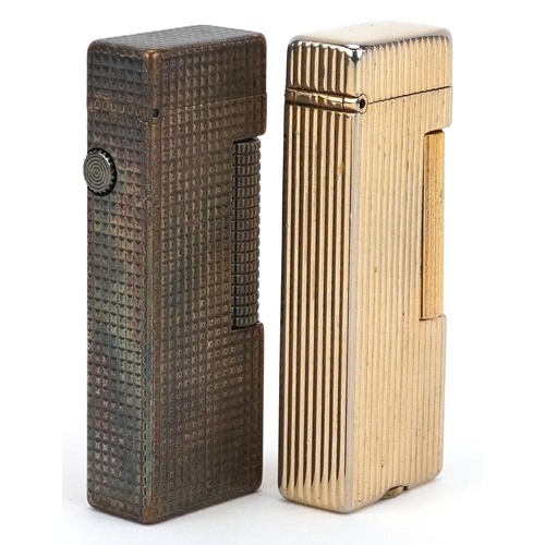 293 - Two Dunhill engine turned pocket lighters, each 6.5cm high.