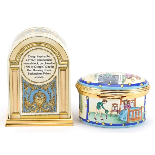 402 - A Halcyon Days enamelled Peter Pan trinket box and a Buckingham Palace enamelled clock, each with fi... 