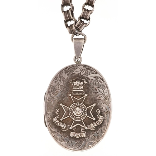 760 - A military interest King's Rifles Peninsula white metal locket on a white metal necklace, the locket... 