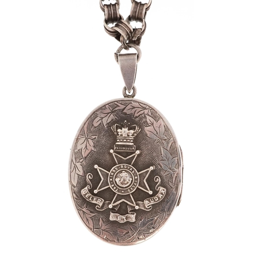 760 - A military interest King's Rifles Peninsula white metal locket on a white metal necklace, the locket... 