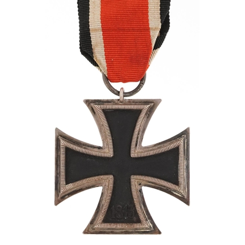 756 - A German military interest Iron Cross with ribbon.