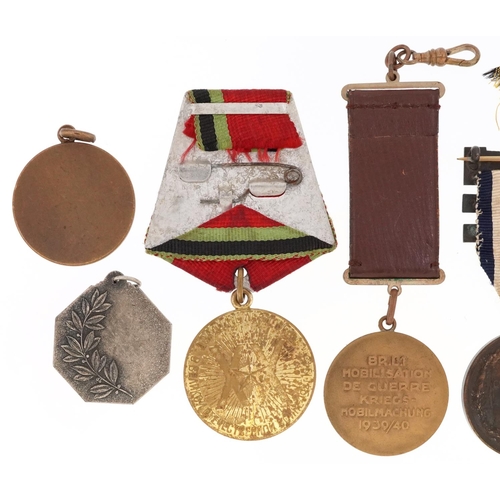 755 - Eight military interest medallions including French Rally Cyclist's Military, Field Marshal Lord Rob... 