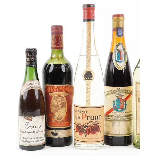 393 - Seven bottles of alcohol including Curaçao Triple Sec, Cazanove cherry brandy and Cherry Monin cherr... 