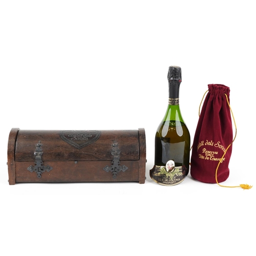 387 - A bottle of Castell dels Sorells Tête de Couvage with carved oak box.