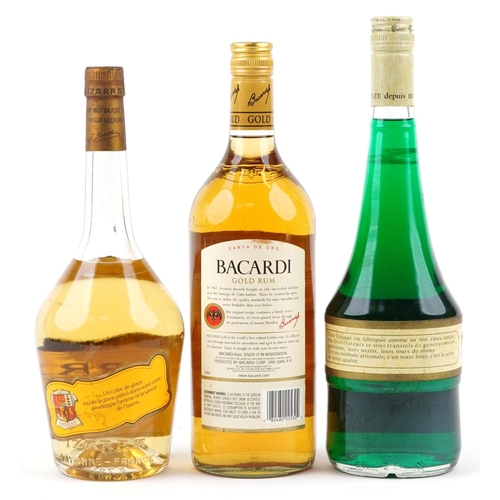 394 - Three bottles of alcohol including Bacardi Superior rum and Izarra liqueur.