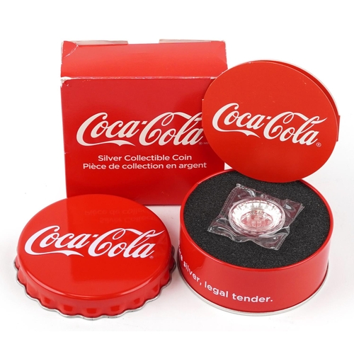 1493 - A Coca Cola advertising silver proof one dollar coin with tin box and certificate.