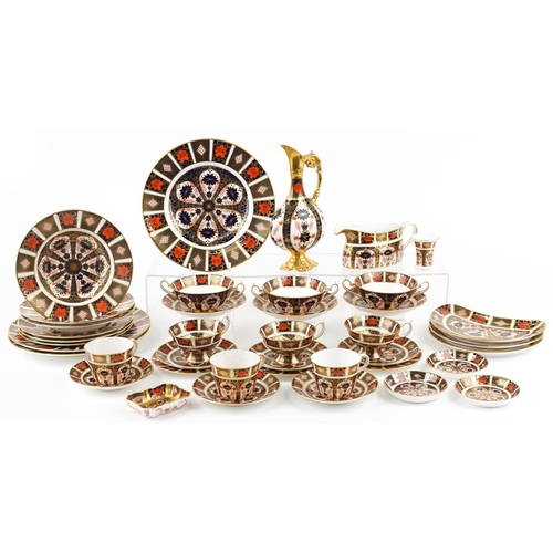 A selection of Royal Crown Derby Old Imari dinner and teaware including six cups and saucers, dinner plates, kidney plates and a ewer, the dinner plates 26.5cm in diameter.