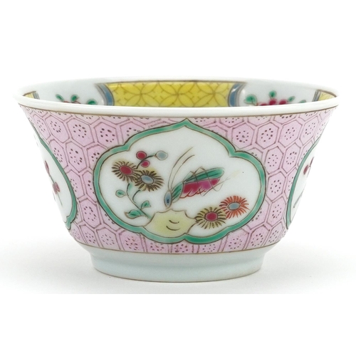 99 - A 20th century Chinese porcelain tea bowl and saucer on stand hand painted with a bird and cherry bl... 