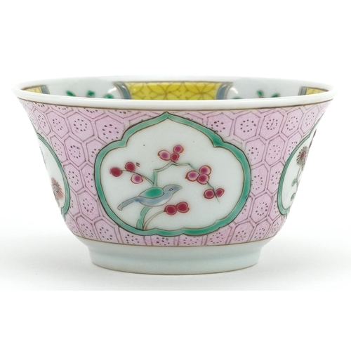 99 - A 20th century Chinese porcelain tea bowl and saucer on stand hand painted with a bird and cherry bl... 