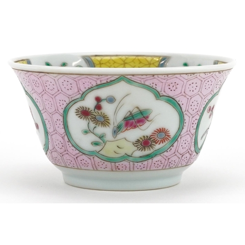 99 - A 20th century Chinese porcelain tea bowl and saucer on stand hand painted with a bird and cherry bl... 